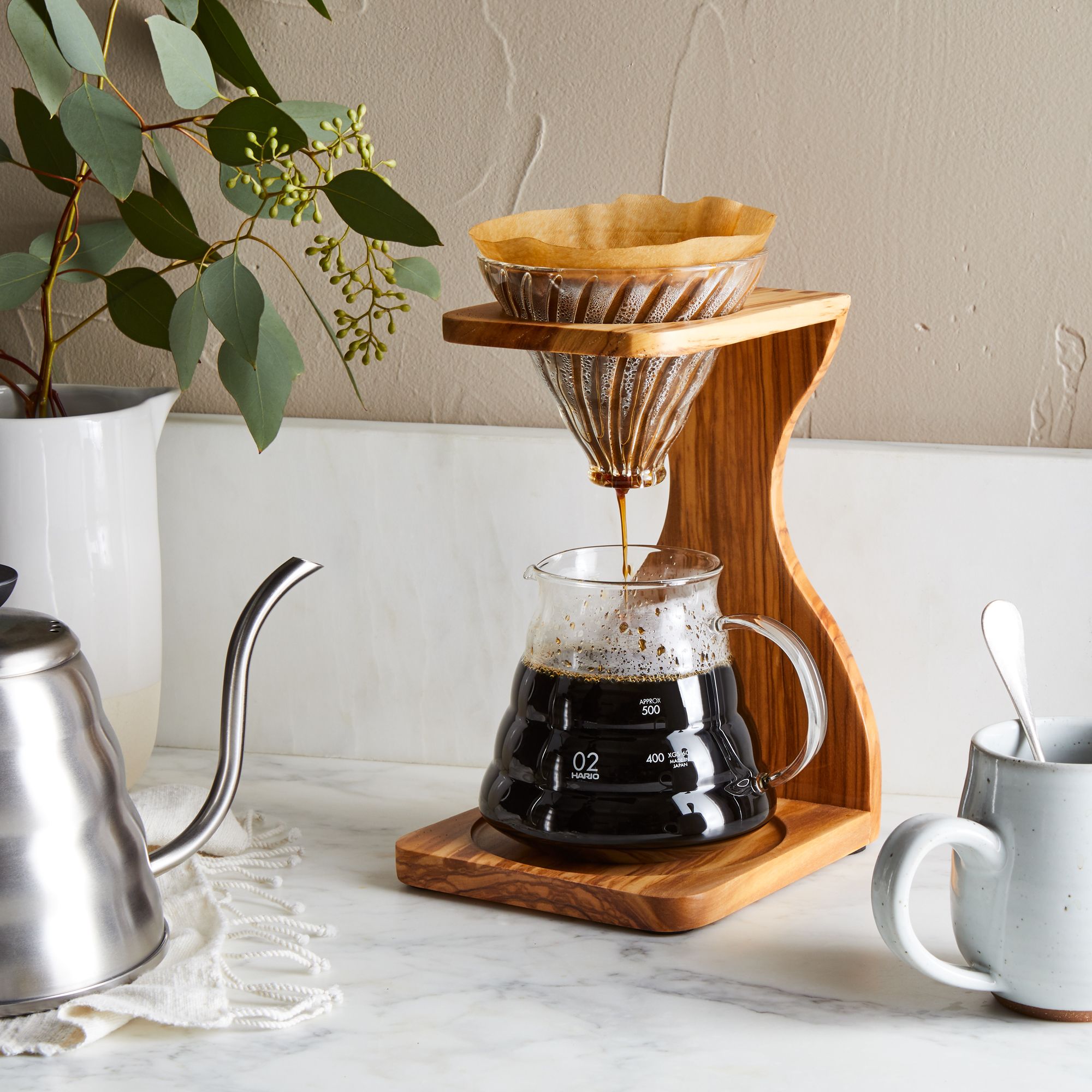 Pour-over coffee brewing setup with dripper and coffee